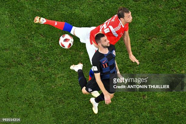 Russia's forward Artem Dzyuba vies with Croatia's midfielder Marcelo Brozovic during the Russia 2018 World Cup quarter-final football match between...