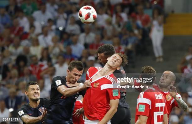Ilya Kutepov of Russia in action against Mario Manzukic of Croatia during the 2018 FIFA World Cup Russia quarter final match between Russia and...