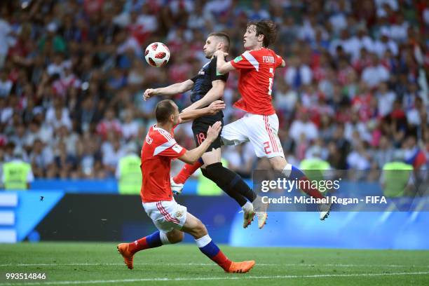 Ante Rebic of Croatia is challenged by Sergey Ignashevich of Russia and Mario Fernandes of Russia during the 2018 FIFA World Cup Russia Quarter Final...