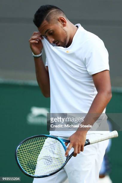 Nick Kyrgios of Australia reacts against Kei Nishikori of Japan during their Men's Singles third round match on day six of the Wimbledon Lawn Tennis...