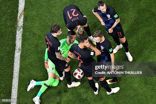 Croatia's goalkeeper Danijel Subasic reacts after getting injured during the Russia 2018 World Cup quarter-final football match between Russia and...