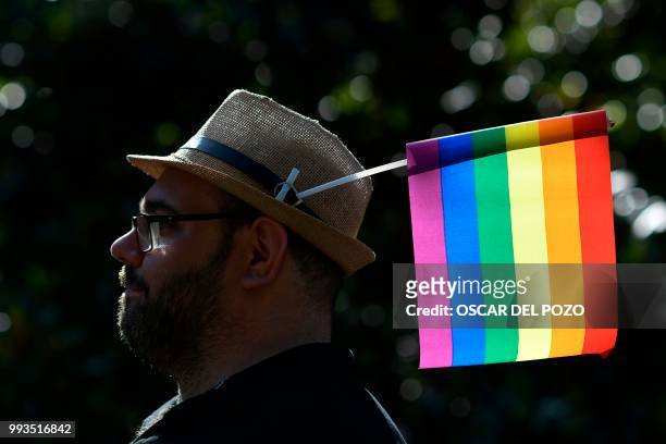 Reveller takes part in the Gay Pride 2018 parade in Madrid, on July 7 one of the world's biggest.