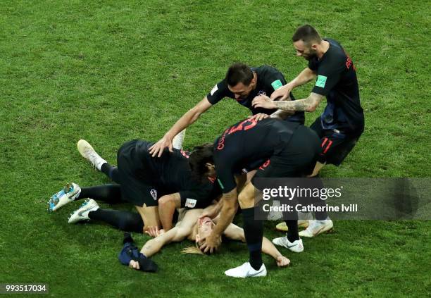 Domagoj Vida of Croatia celebrates with teammates after scoring his team's second goal during the 2018 FIFA World Cup Russia Quarter Final match...