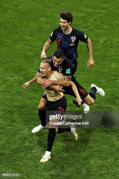 Domagoj Vida of Croatia celebrates with teammate Dejan Lovren after scoring his team's second goal during the 2018 FIFA World Cup Russia Quarter...