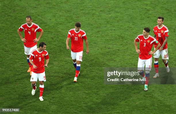Sergey Ignashevich, Alan Dzagoev, Aleksandr Erokhin, Ilya Kutepov and Fedor Smolov of Russia walk away dejected after the second Croatia goal scored...
