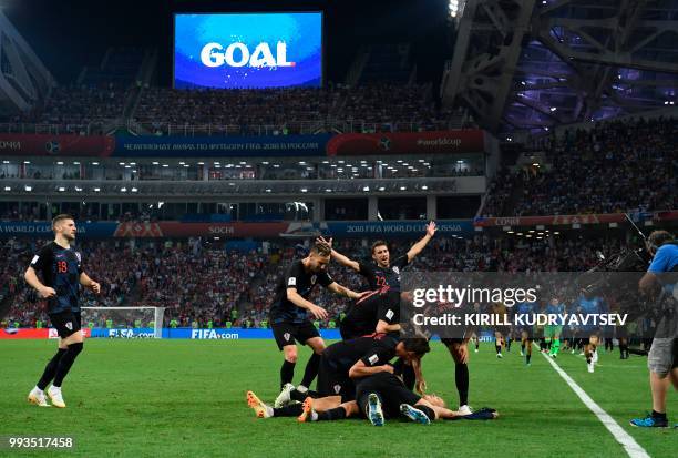 Croatia's players celebrate a goal during the extra time of the Russia 2018 World Cup quarter-final football match between Russia and Croatia at the...