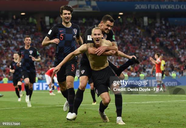 Domagoj Vida of Croatia celebrates after scoring his team's second goal in extra time during the 2018 FIFA World Cup Russia Quarter Final match...