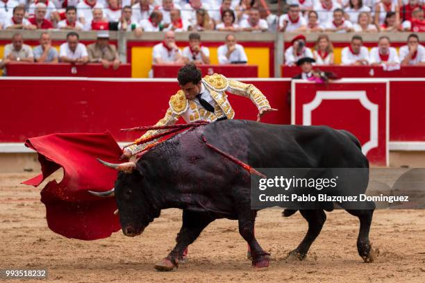 Spanish bullfighter Paco Urena performs with a bull from Puerto de San Lorenzo's fighting bulls during a bullfight on the second day of the San...