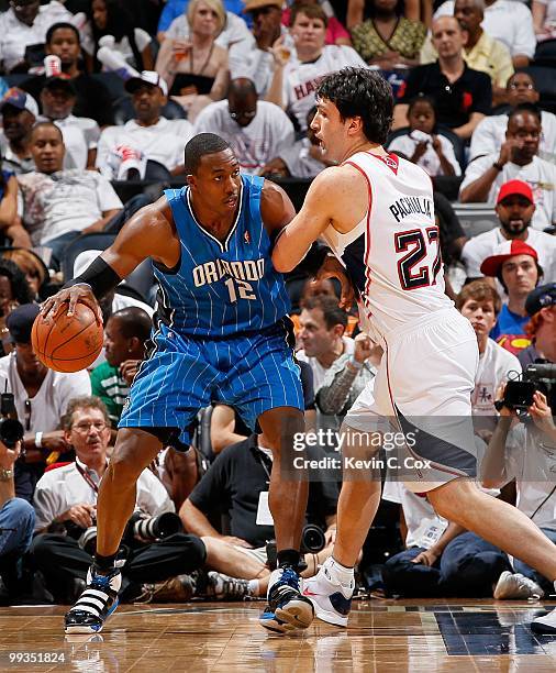 Dwight Howard of the Orlando Magic against Zaza Pachulia of the Atlanta Hawks during Game Three of the Eastern Conference Semifinals during the 2010...