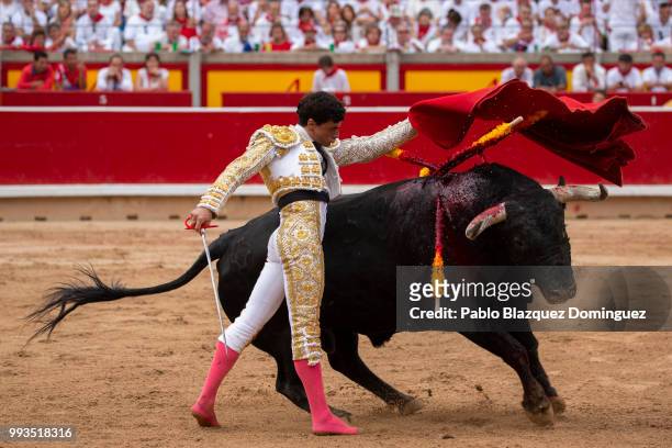 Spanish bullfighter Paco Urena performs with a bull from Puerto de San Lorenzo's fighting bulls during a bullfight on the second day of the San...