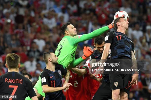 Croatia's goalkeeper Danijel Subasic punches the ball away during the extra time of the Russia 2018 World Cup quarter-final football match between...