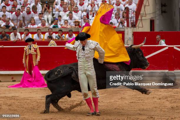 Spanish bullfighter Roman performs with a bull from Puerto de San Lorenzo's fighting bulls during a bullfight on the second day of the San Fermin...