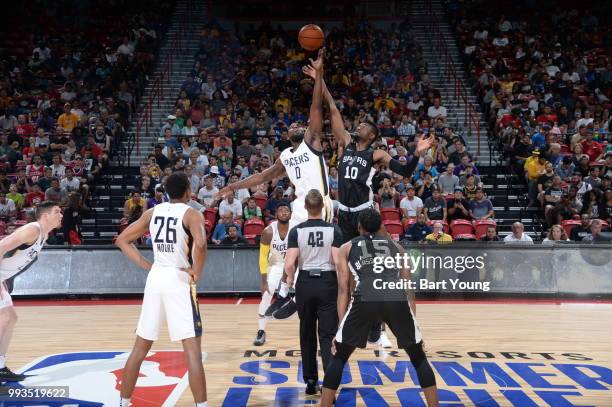 Chimezie Metu of the San Antonio Spurs and Alex Poythress of the Indiana Pacers tipoff during the 2018 Las Vegas Summer League on July 7, 2018 at the...