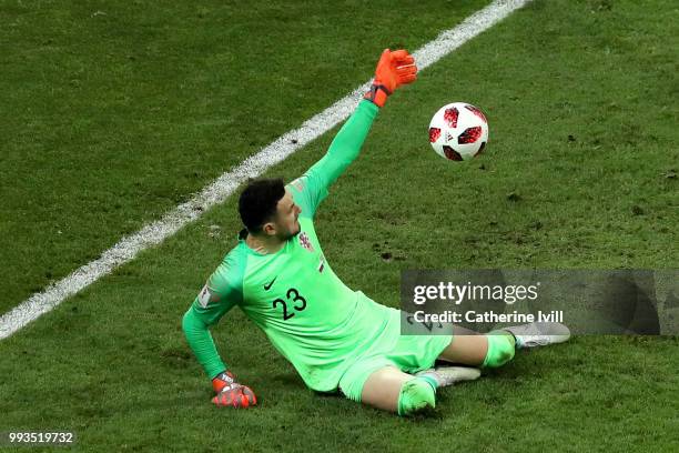 Danijel Subasic of Croatia saves the first penalty from Fedor Smolov of Russia in the penalty shoot out during the 2018 FIFA World Cup Russia Quarter...