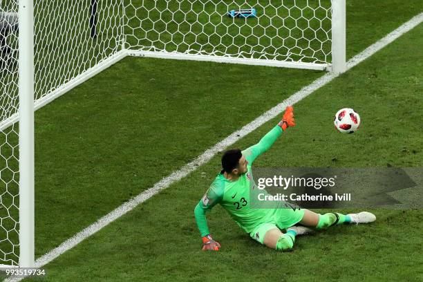 Danijel Subasic of Croatia saves the first penalty from Fedor Smolov of Russia in the penalty shoot out during the 2018 FIFA World Cup Russia Quarter...