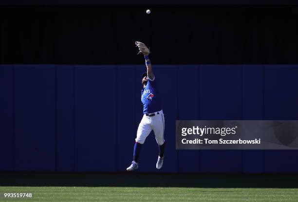 Kevin Pillar of the Toronto Blue Jays overruns a double hit by Brandon Drury of the New York Yankees in the first inning during MLB game action at...