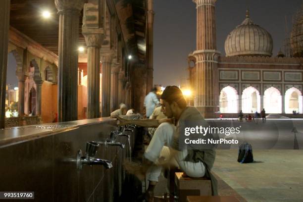 Muslims perform ablution before Isha prayers at Historic Jamia Masjid in Old Quarters of Delhi, India, on 7 July 2018.