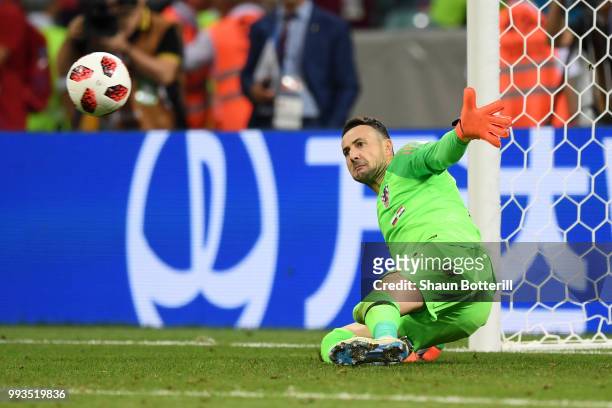 Danijel Subasic of Croatia saves the first penalty from Fedor Smolov of Russia in the penalty shoot out during the 2018 FIFA World Cup Russia Quarter...