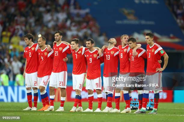 Players from Russia look on from the half way line during the penalty shoot out during the 2018 FIFA World Cup Russia Quarter Final match between...