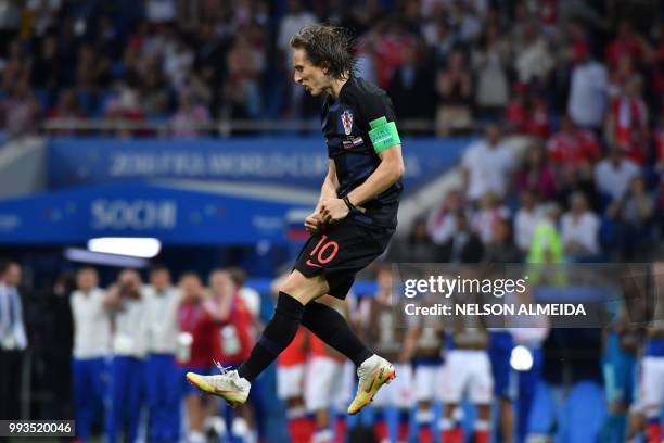 Croatia's midfielder Luka Modric celebrates after scoring from the penalty spot during the Russia 2018 World Cup quarter-final football match between...