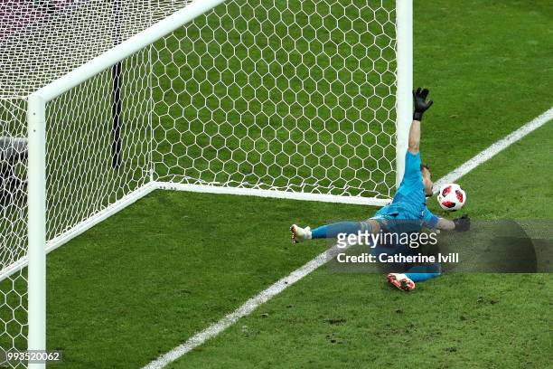 Igor Akinfeev of Russia saves the second penalty from Mateo Kovacic of Croatia in the penalty shoot out during the 2018 FIFA World Cup Russia Quarter...