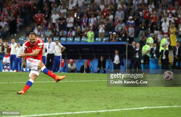 Sergey Ignashevich scores his team's fourth penalty in the penalty shoot out during the 2018 FIFA World Cup Russia Quarter Final match between Russia...