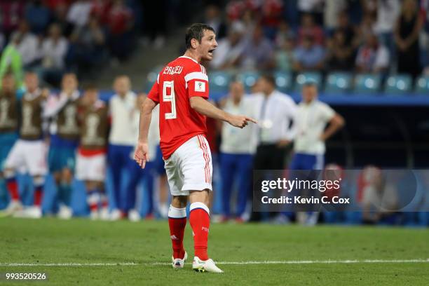 Alan Dzagoev of Russia celebrates scoring his team's second penalty in the penalty shoot out during the 2018 FIFA World Cup Russia Quarter Final...