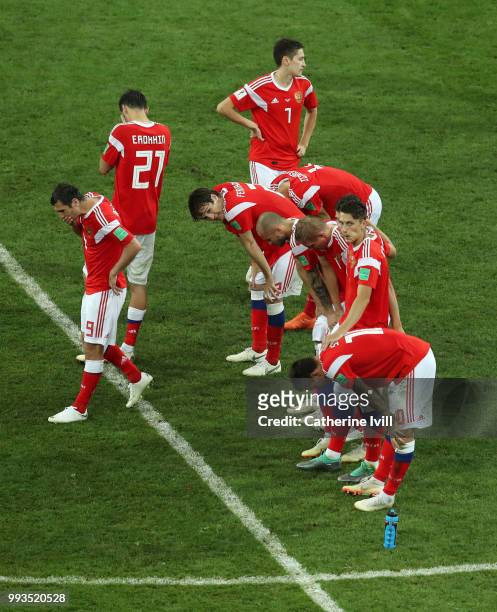Russia players look dejected following their defeat in the penalty shoot out during the 2018 FIFA World Cup Russia Quarter Final match between Russia...