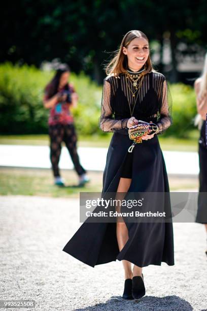 Olivia Palermo wears a black lace mesh dress and a necklace , outside Dior, during Paris Fashion Week Haute Couture Fall Winter 2018/2019, on July 2,...