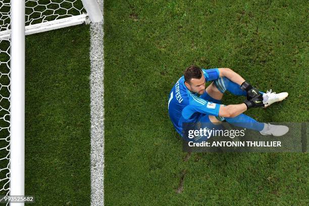 Russia's goalkeeper Igor Akinfeev reacts at the end of the penalty shootouts of the Russia 2018 World Cup quarter-final football match between Russia...
