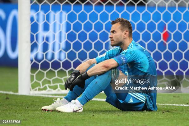 Igor Akinfeev of Russia looks dejected after losing in a penalty shootout during the 2018 FIFA World Cup Russia Quarter Final match between Russia...