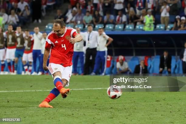 Sergey Ignashevich of Russia scores his team's fourth penalty in the penalty shoot out during the 2018 FIFA World Cup Russia Quarter Final match...