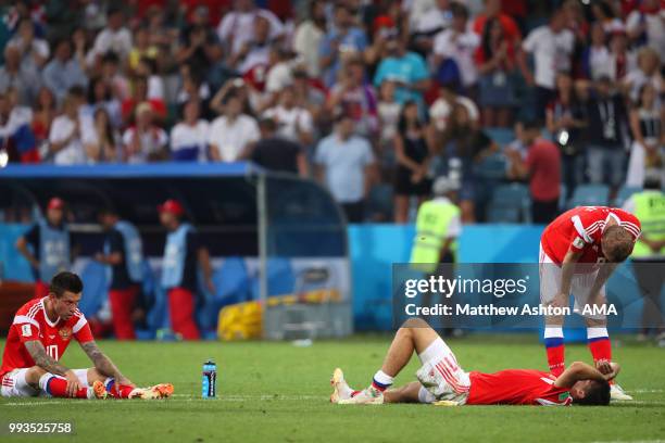 Fedor Smolov of Russia and his team-mates looks dejected after losing in a penalty shootout during the 2018 FIFA World Cup Russia Quarter Final match...