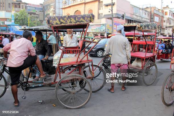 Rickshaw puller waits for the passengers at Chandi Chowk in Old Delhi, India, on 7 July 2018.
