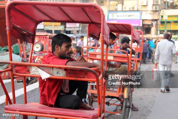 Rickshaw puller waits for the passegers in Delhi, India, on 7 July 2018.