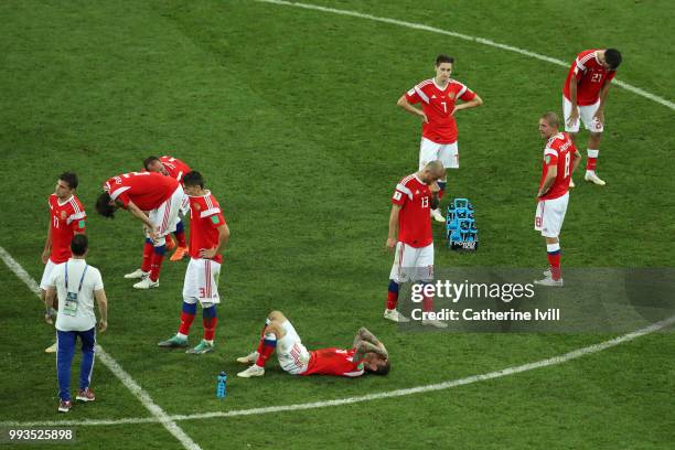 Players of Russia show their dejection following the defeat in the 2018 FIFA World Cup Russia Quarter Final match between Russia and Croatia at Fisht...