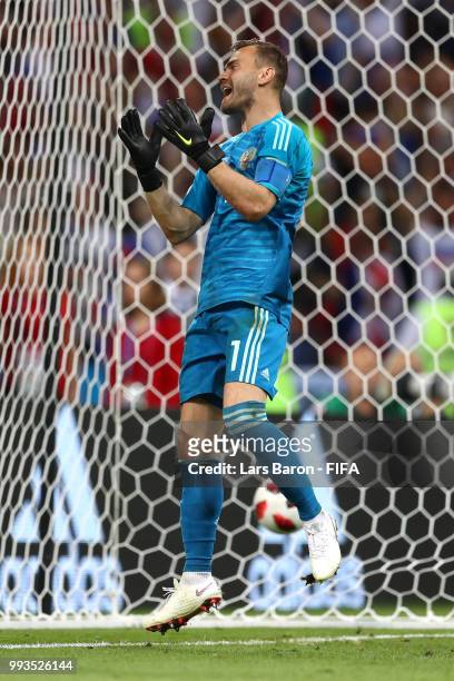Igor Akinfeev of Russia shows his frustration in the penalty shoot out during the 2018 FIFA World Cup Russia Quarter Final match between Russia and...