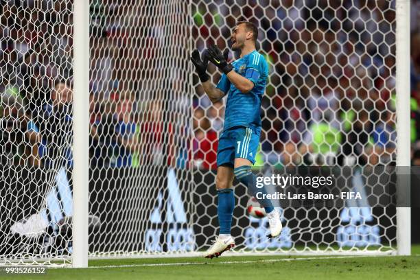 Igor Akinfeev of Russia shows his frustration in the penalty shoot out during the 2018 FIFA World Cup Russia Quarter Final match between Russia and...