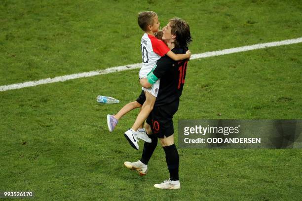 Croatia's midfielder Luka Modric celebrates with his son Ivano at the end of the penalty shootouts of the Russia 2018 World Cup quarter-final...