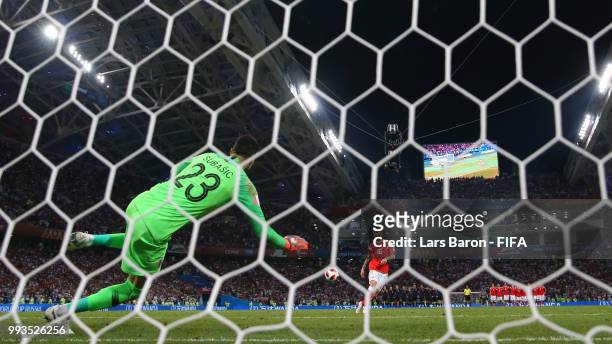 Danijel Subasic of Croatia saves the first penalty from Fedor Smolov of Russia in the penalty shoot out during the 2018 FIFA World Cup Russia Quarter...
