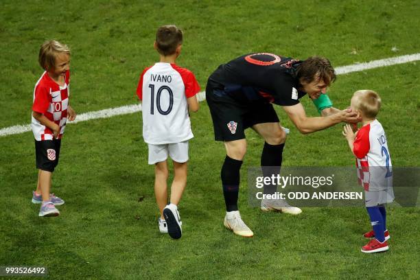 Croatia's midfielder Luka Modric celebrates with his son Ivano at the end of the penalty shootouts of the Russia 2018 World Cup quarter-final...