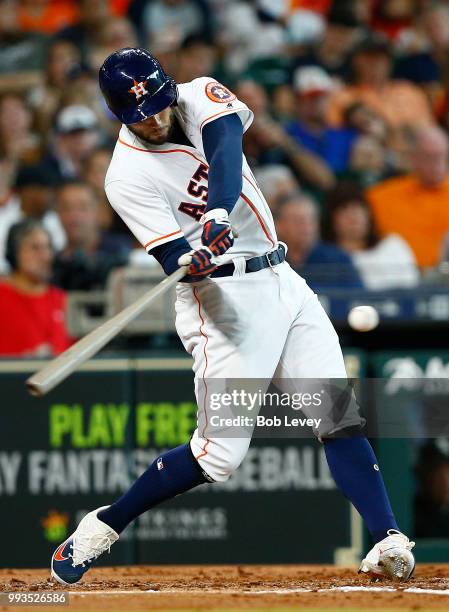 George Springer of the Houston Astros singles in the third inning against the Chicago White Sox at Minute Maid Park on July 7, 2018 in Houston, Texas.