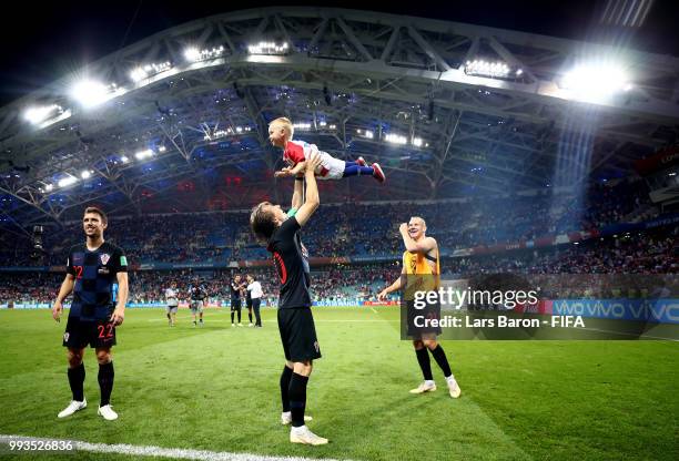 Luka Modric of Croatia celebrates with Domagoj Vida of Croatia's son following Croatia's victory in the 2018 FIFA World Cup Russia Quarter Final...
