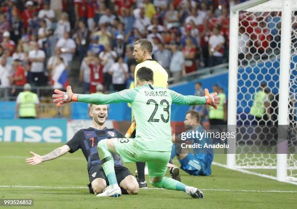 Ivan Rakitic of Croatia celebrates with his teammate Subasic after winning the penalty shootout of the 2018 FIFA World Cup Russia quarter final match...