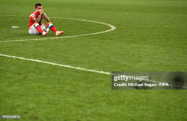 Fedor Smolov of Russia looks dejected follwing his team's defeat in the 2018 FIFA World Cup Russia Quarter Final match between Russia and Croatia at...