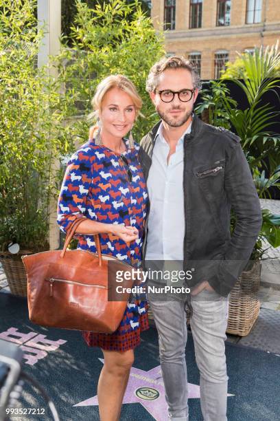 Caroline Beil and her boyfriend Philipp Sattler arrive to attend the Riani Fashion Show during the Mercedes Benz Fashion Week at ewerk in Berlin,...