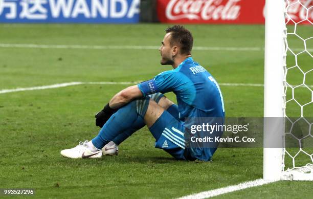 Igor Akinfeev of Russia sits dejected following his sides defeat in the penalty shoot out during the 2018 FIFA World Cup Russia Quarter Final match...