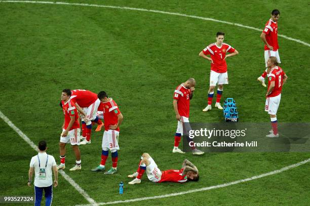 Players of Russia show their dejection following the defeat in the 2018 FIFA World Cup Russia Quarter Final match between Russia and Croatia at Fisht...
