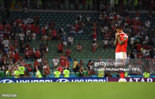 Fedor Smolov of Russia looks dejected follwing his team's defeat in the 2018 FIFA World Cup Russia Quarter Final match between Russia and Croatia at...