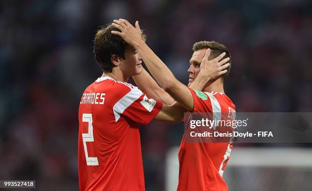 Mario Fernandes of Russia is consoled by Denis Cheryshev after losing to Croatia in extra time penalty shoot-out during the 2018 FIFA World Cup...